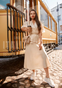 Effortlessly chic in soft neutrals—this flowy skirt and matching wrap top, paired with sneakers, strike the perfect balance between casual comfort and sophisticated style for your city stroll.