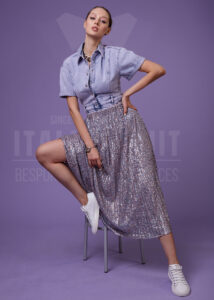 Sparkle meets street style in this stunning sequin skirt, perfectly contrasted with a casual denim shirt and sneakers. A playful blend of glam and comfort for a look that shines day or night.